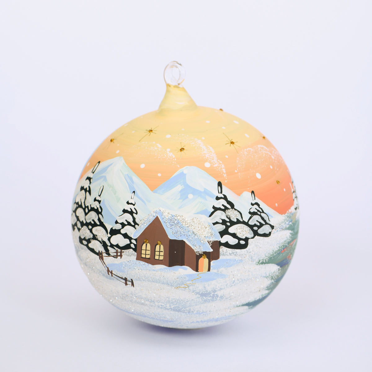 Weihnachtskugel Sonnenaufgang und Winterlandschaft