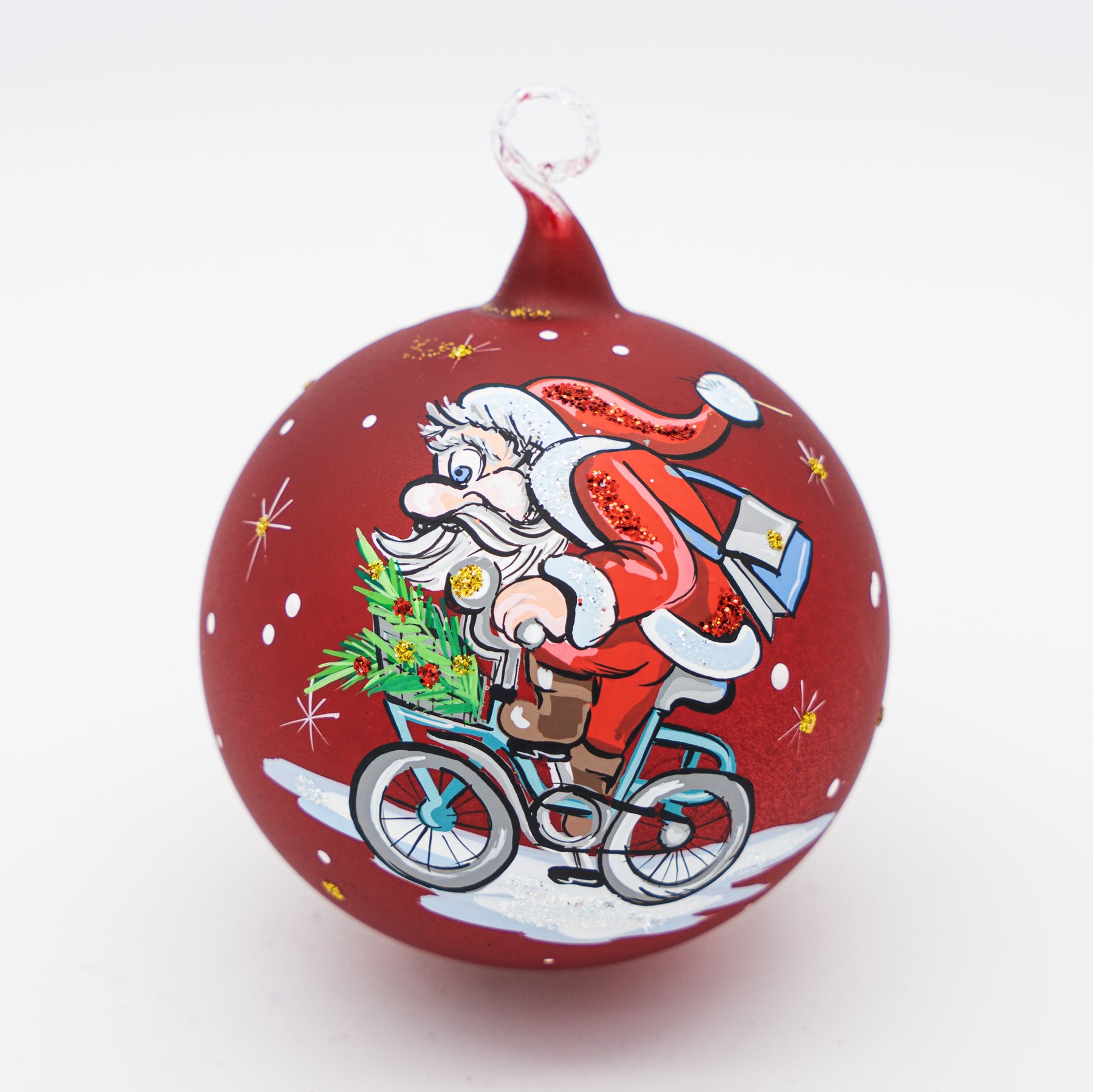 Weihnachtskugel mit Weihnachtsmann auf Fahrrad
